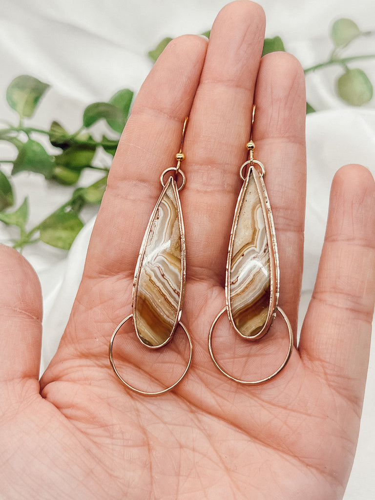 These 2-1/2” boho/western Jasper dangle earrings are made more stunning with the addition of shiny 14k goldfill embellishments. The nestled Jasper adds a pop of color, and the earring hooks are hypoallergenic for comfortable wear.